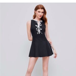 Classic Black Sleeveless Dress with White Trim and Bows